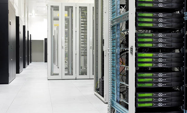 A room with servers and cables inside a data centre