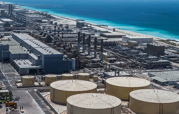 Modern desalination plant by a beach in the Arabian Gulf