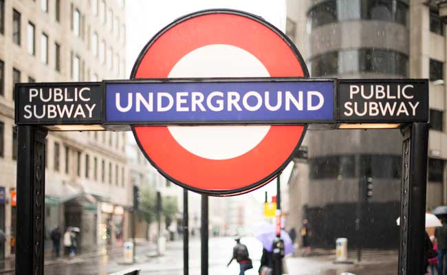 London Underground roundel on a rainy street